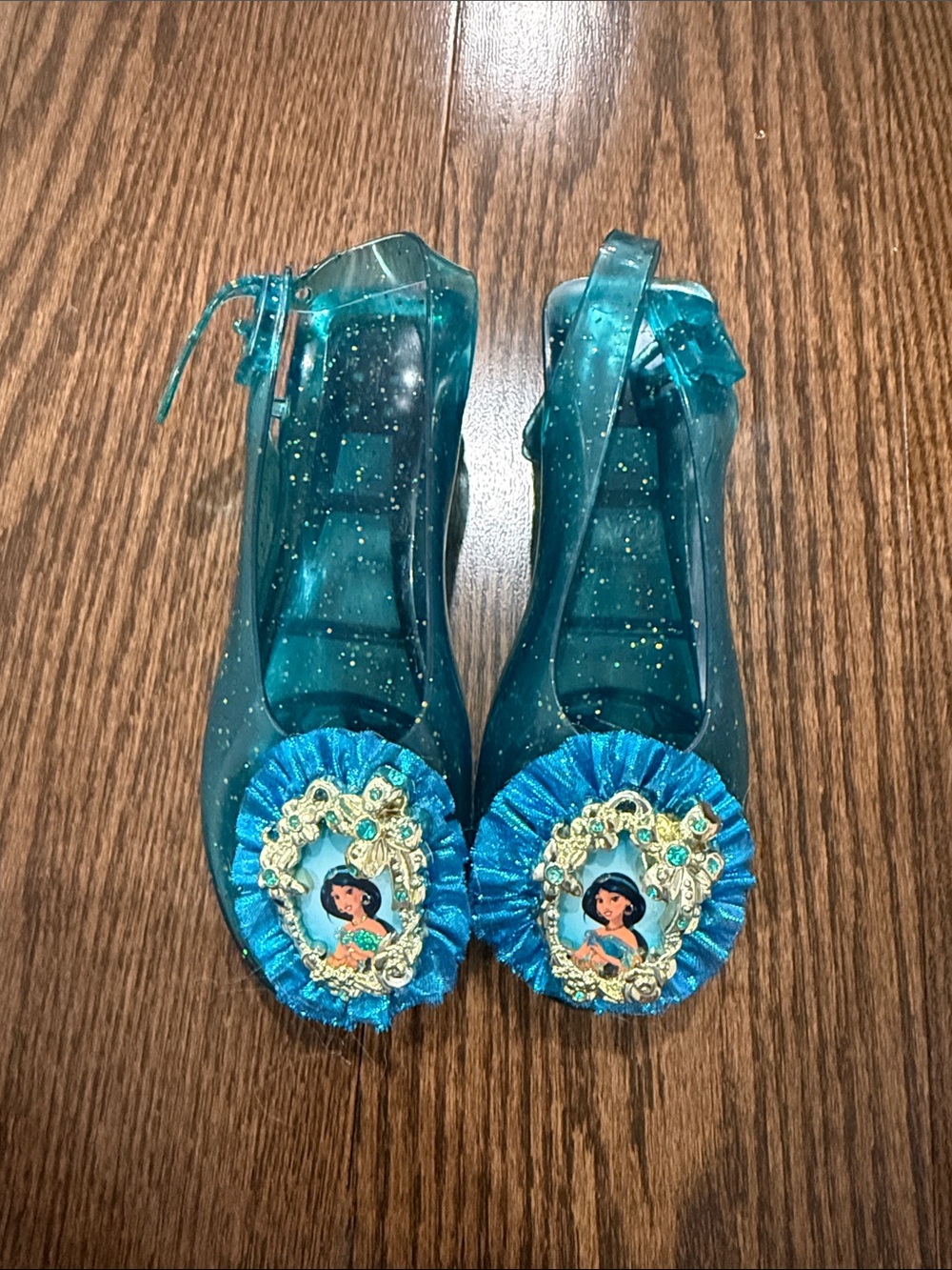 Girls Teal Glitter Jelly Shoes with Princess Medallion